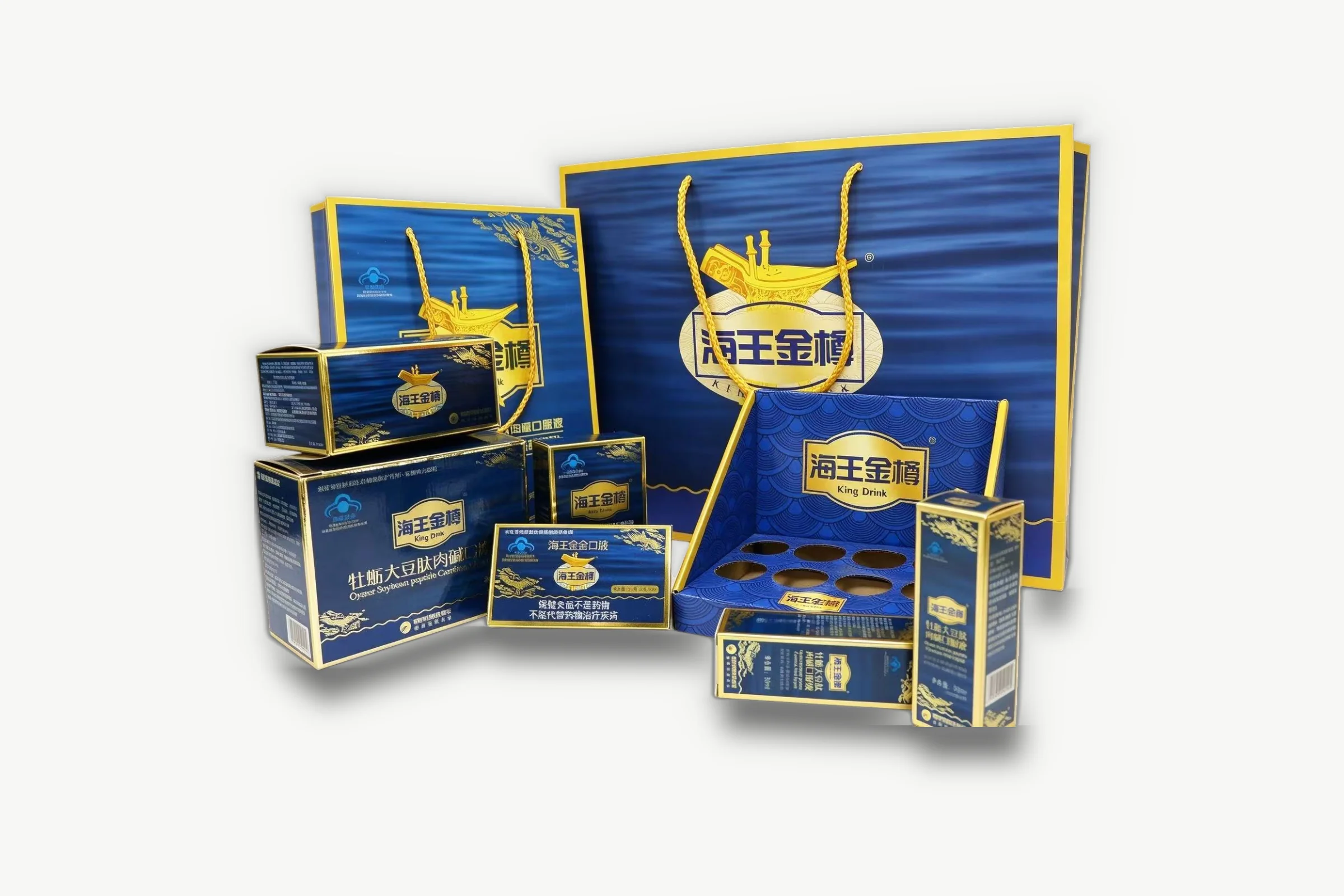 Neptunus Jinzun gift set in deep blue and gold-tone: cartons, a display box with round recesses and carrier bags